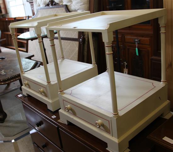 A pair of white painted bedside tables
